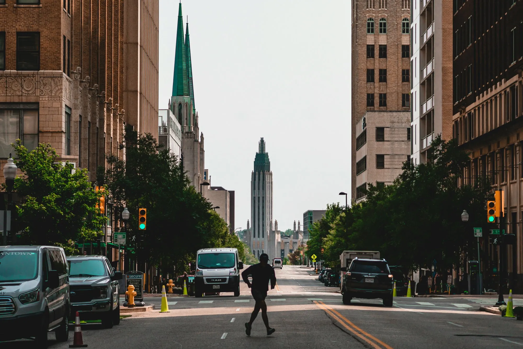 The Art Deco tower of Boston Avenue United Methodist Church at the end of a downtown street